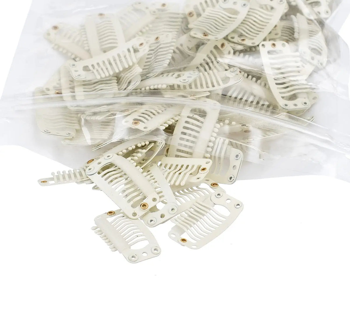 A clear plastic bag filled with numerous white hair extension snap clips for wigs.