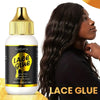Eine Flasche Luxe Klebstoffspray mit goldener Kappe neben einem Gesichts einer Frau.