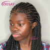 A woman modeling a long black braided wig with a full lace front