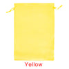 A bright yellow satin wig storage bag with a drawstring closure.