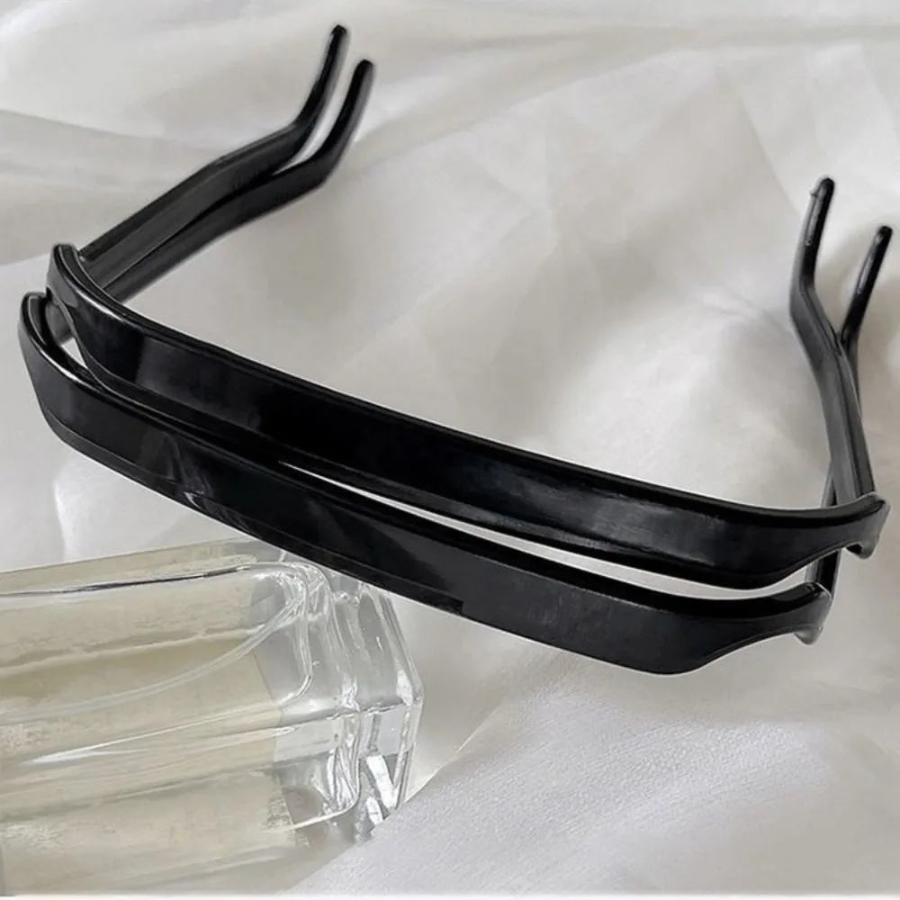 Black 3-piece sleek hair sticks for elegant styling displayed on a white surface.