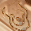Gold chain necklace set featuring dainty rhinestone heart charms