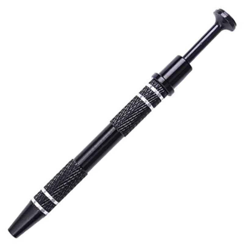 A black precision four-claw jewelry pick-up tool with textured grip and a pointed tip.