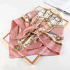 A pink silk print shawl featuring intricate gold embroidery and detailed patterns for women and hijab.