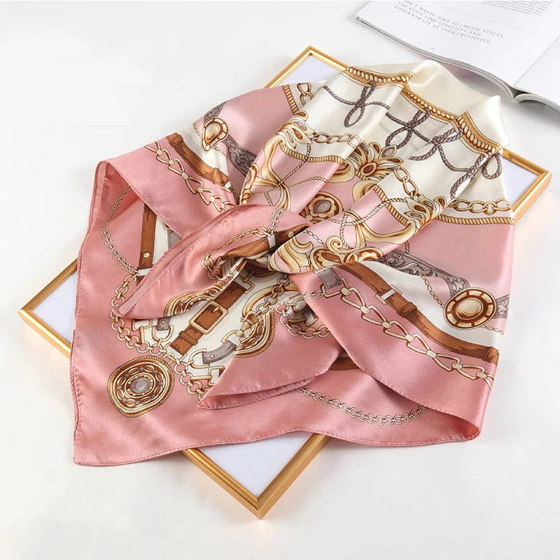 A pink silk print shawl featuring intricate gold embroidery and detailed patterns for women and hijab.