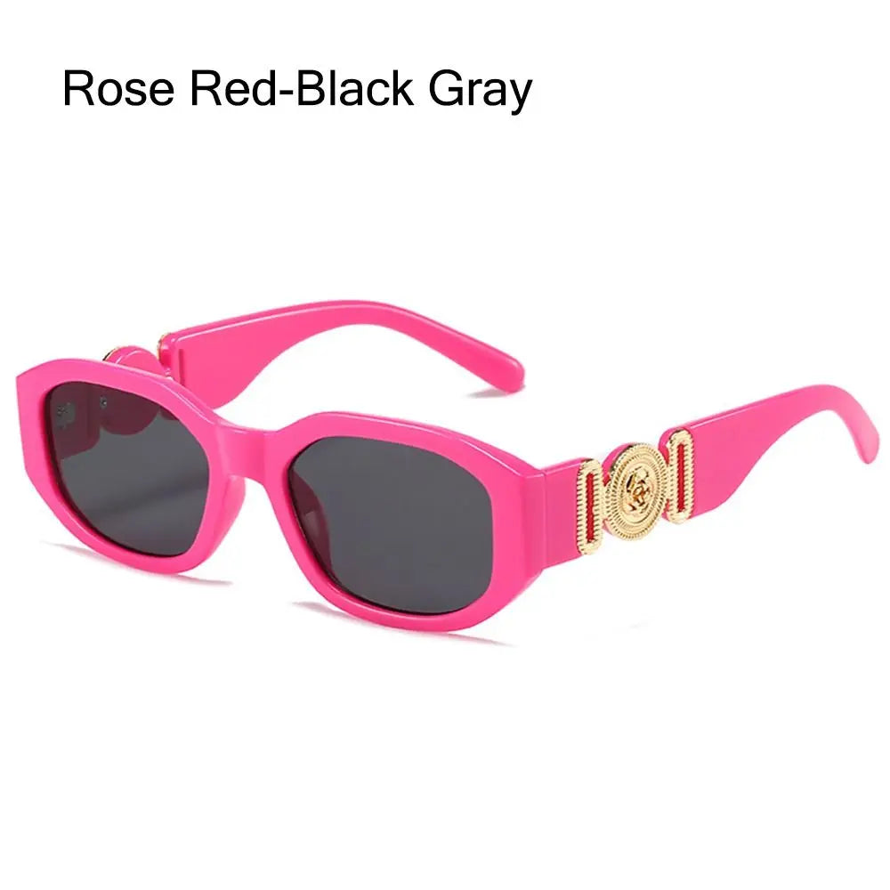 Pink sunglasses with rose red lenses and black frames featuring gold metal detailing