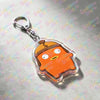 An orange cartoon character keychain with a yellow loop attached.