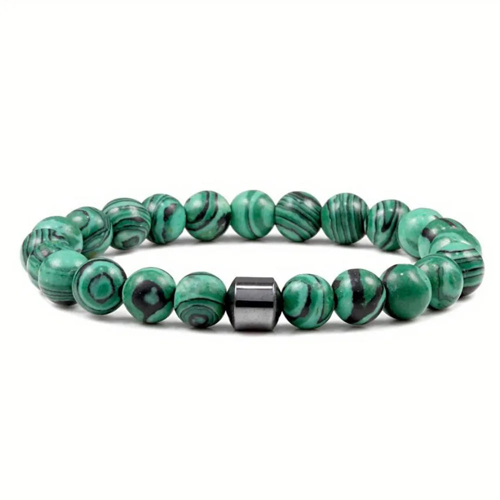 A bracelet made of polished green and black tiger eye lava map beads.