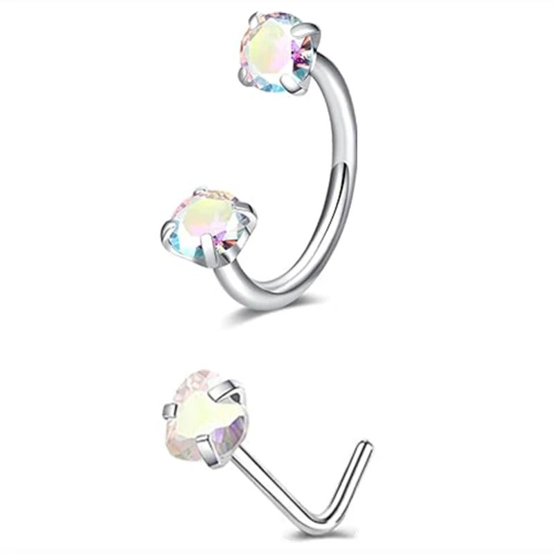 A set of silver horseshoe nose rings with clear and iridescent stones.