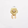 Gold floral button cufflinks with pearl accents, measuring 2.4 cm.