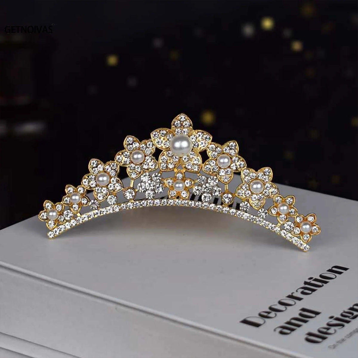 A gold-toned sparkling crystal princess tiara hair comb for women displayed on a white box.