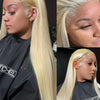 A close-up photo of a model wearing a blonde straight HD lace front wig with long hair and a black top.