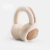 A pair of classic winter ear muffs made of light beige faux fur.
