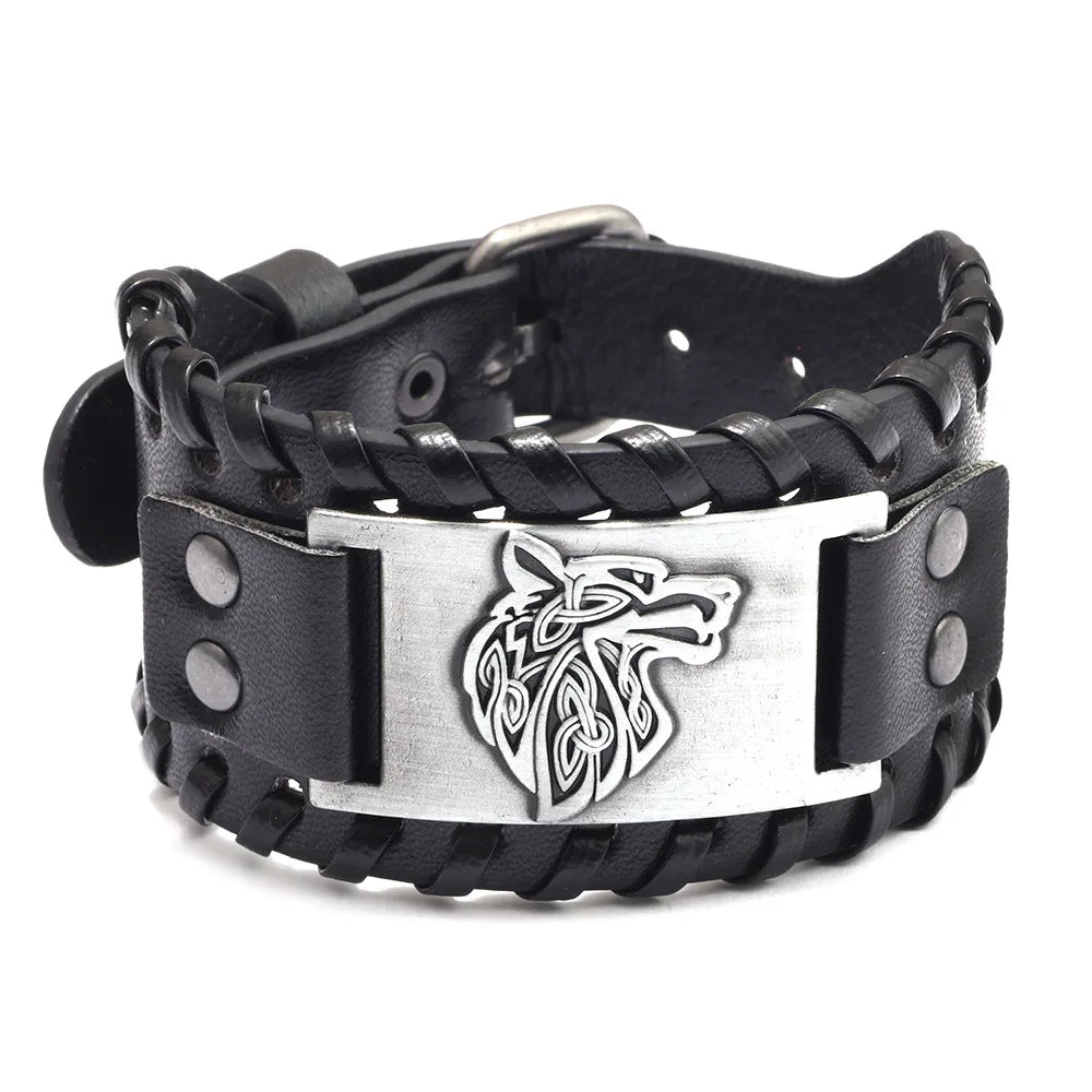 A black leather bracelet featuring a silver carved horse head design and a woven texture.