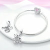Sterling silver devil's eye charm bracelet with a heart pendant and various charms