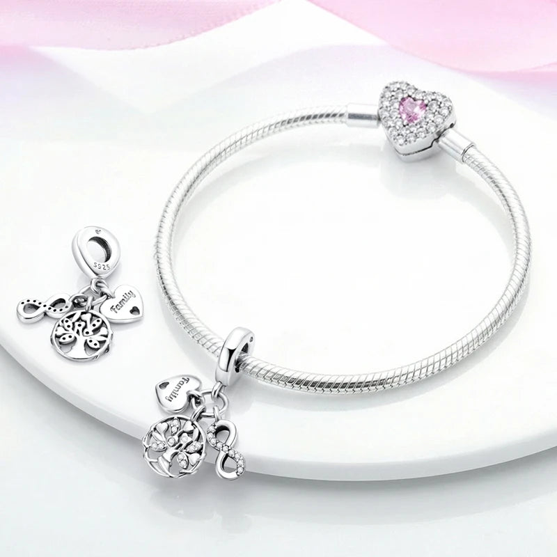 Sterling silver devil's eye charm bracelet with a heart pendant and various charms