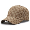 A beige cotton baseball cap featuring a repeating brown dot pattern.