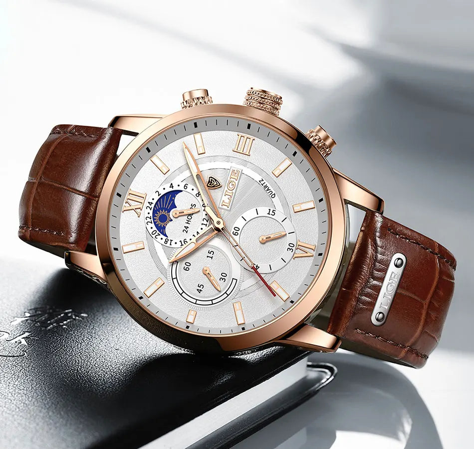 A luxury rose gold men's quartz watch with a brown leather strap and chronograph features a silver dial.