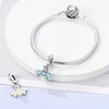 Sterling silver devil's eye charm bracelet with a silver clasp and a light blue floral pendant