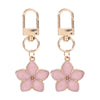 Llavero floral dorado con dije en forma de corazón para llaves y bolsos