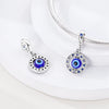 Sterling silver devil's eye charm bracelet featuring a round blue and black gemstone pendant.