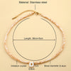 A delicate stainless steel necklace featuring a single imitation crystal bead and a gold-colored chain.