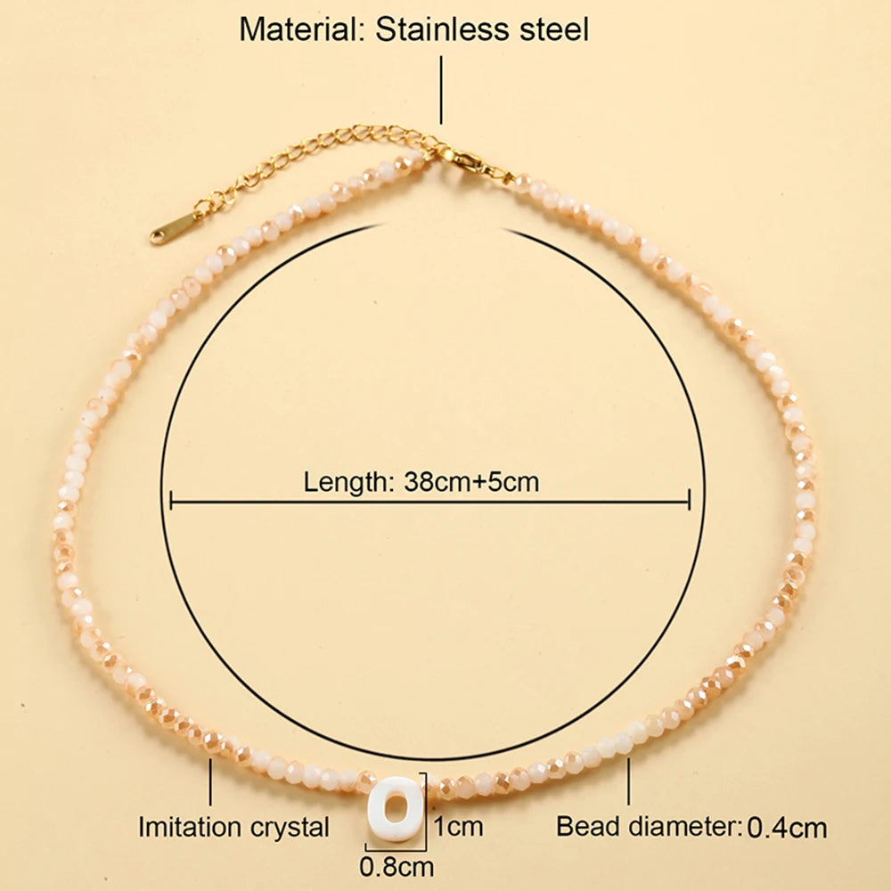 A delicate stainless steel necklace featuring a single imitation crystal bead and a gold-colored chain.