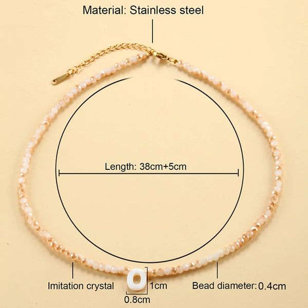 A delicate stainless steel necklace featuring a single imitation crystal bead and a gold-colored chain.