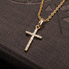 A gold chain necklace featuring a cross pendant made of sparkling zircon stones.