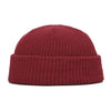 A solid maroon knitted beanie cap with a ribbed texture.