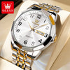 Silber- und Gold-OLEVS-Quarz-Armbanduhr mit Krönchenmotiv auf der Zifferblatt, auf hellem Hintergrund.