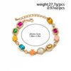 A multi-color enamel tennis chain necklace featuring various colored gemstone-like charms.