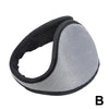 A gray plush winter earmuff is shown in a profile view.