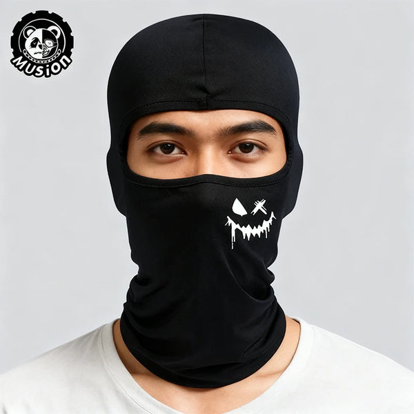 A man wearing a black breathable mesh balaclava with a white dripping face design.