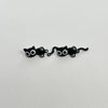 A pair of cute black cat stud earrings featuring small, stylized cats.