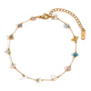 A delicate gold-plated chain bracelet featuring small, crushed stone beads.