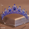 Blue crystal baroque bridal tiara headpiece displayed on a box with a measurement scale.