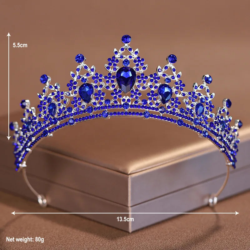 Blue crystal baroque bridal tiara headpiece displayed on a box with a measurement scale.