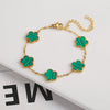 Pulsera de acero inoxidable chapada en oro con charms florales de planta en esmalte verde