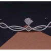 A sparkling cubic zirconia bridal tiara headband with a floral design displayed on a brown surface.