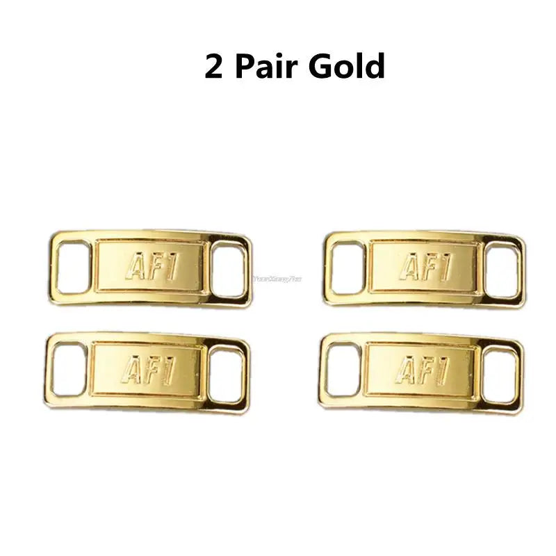 Two pairs of gold AF1 shoe charms and laces.