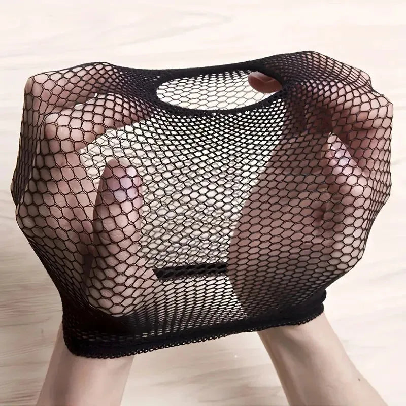 A hand is holding a black mesh wig cap designed for long hair.