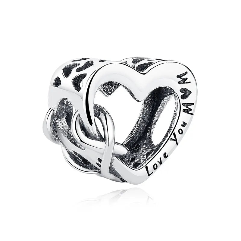 A silver heart-shaped charm featuring a delicate family tree design and the inscription Love You Mom