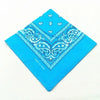 A bright blue cotton bandana scarf featuring white paisley and geometric patterns.