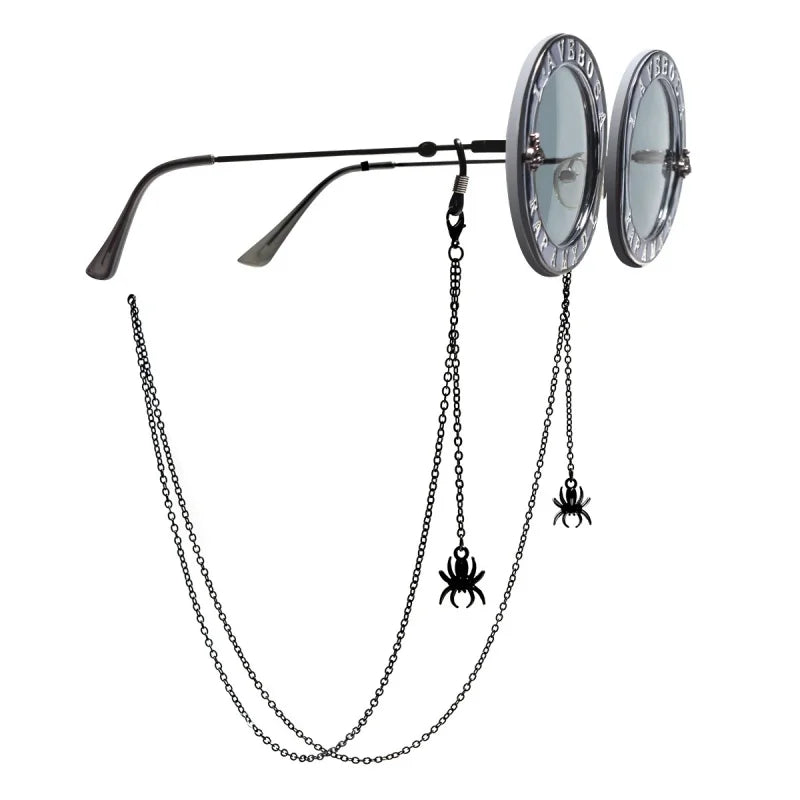A pair of punk spider glasses suspended from a long chain necklace
