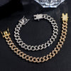 A set of gold and silver crystal Cuban link chains and anklets displayed on a black surface.