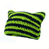 A knitted beanie hat featuring horizontal stripes of black and lime green yarn.