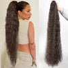 A woman shows off long, dark brown synthetic drawstring hair extensions styled in a high ponytail.