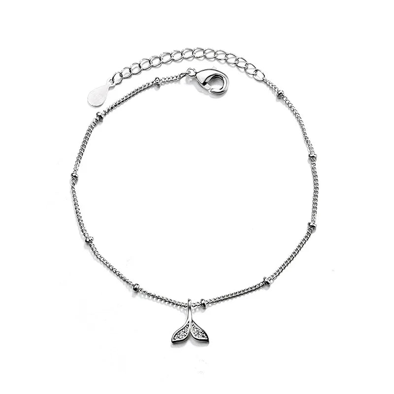 Sterling silver double heart charm bracelet with a delicate chain and a small leaf pendant