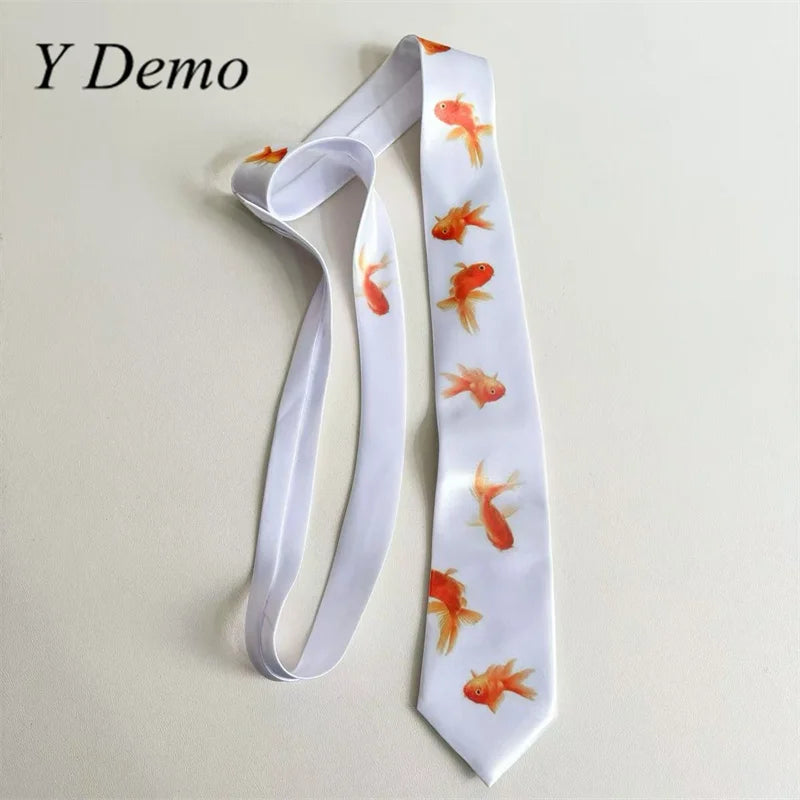 A white long neck tie featuring a repeating pattern of orange goldfish prints.